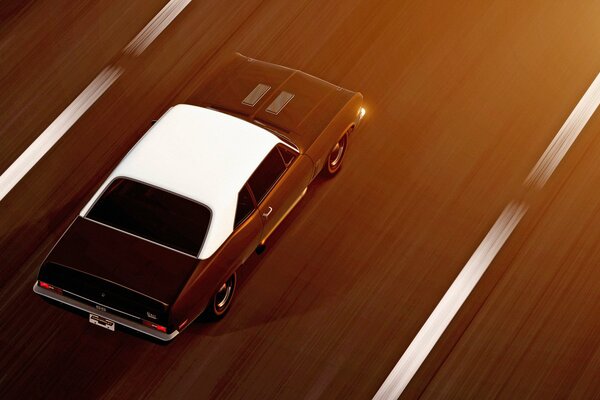 A car moving forward on a marked road