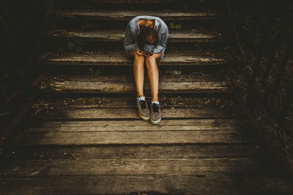 Crying girl on the stairs