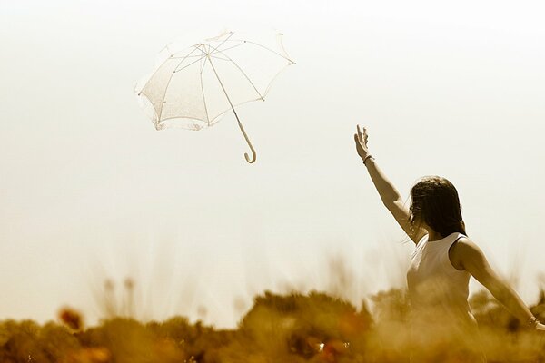 A girl with an umbrella on a beautiful background