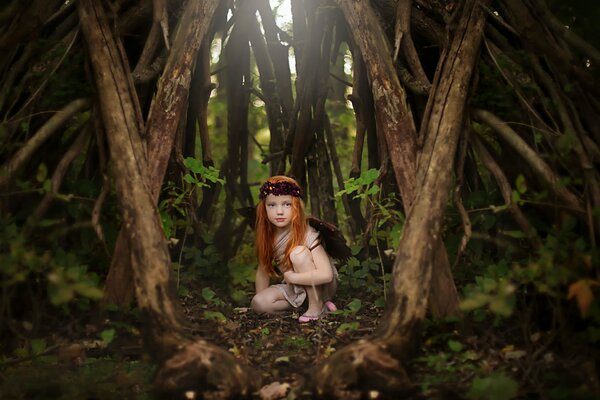 Red-haired girl in the forest