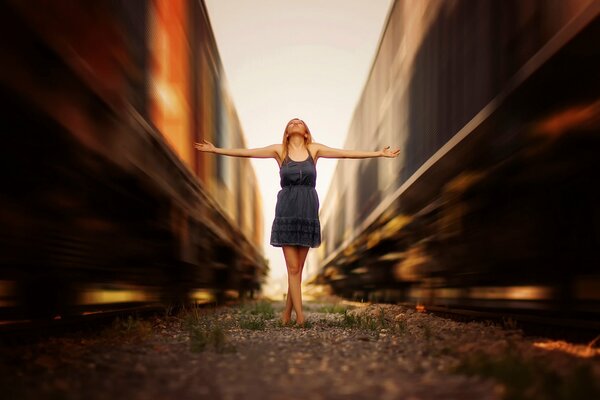 The girl between two trains