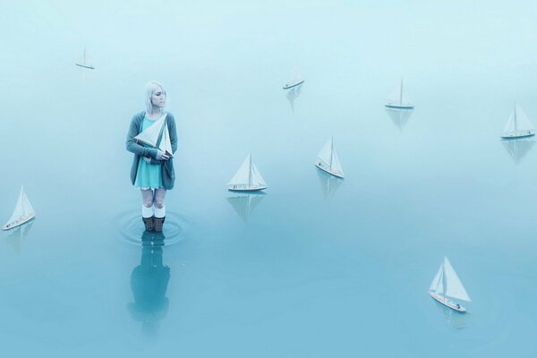 A girl among the boats on the water