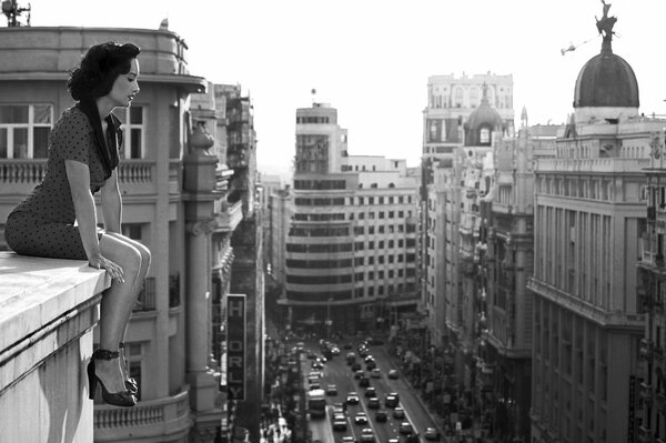 Retro photo of a girl on the roof