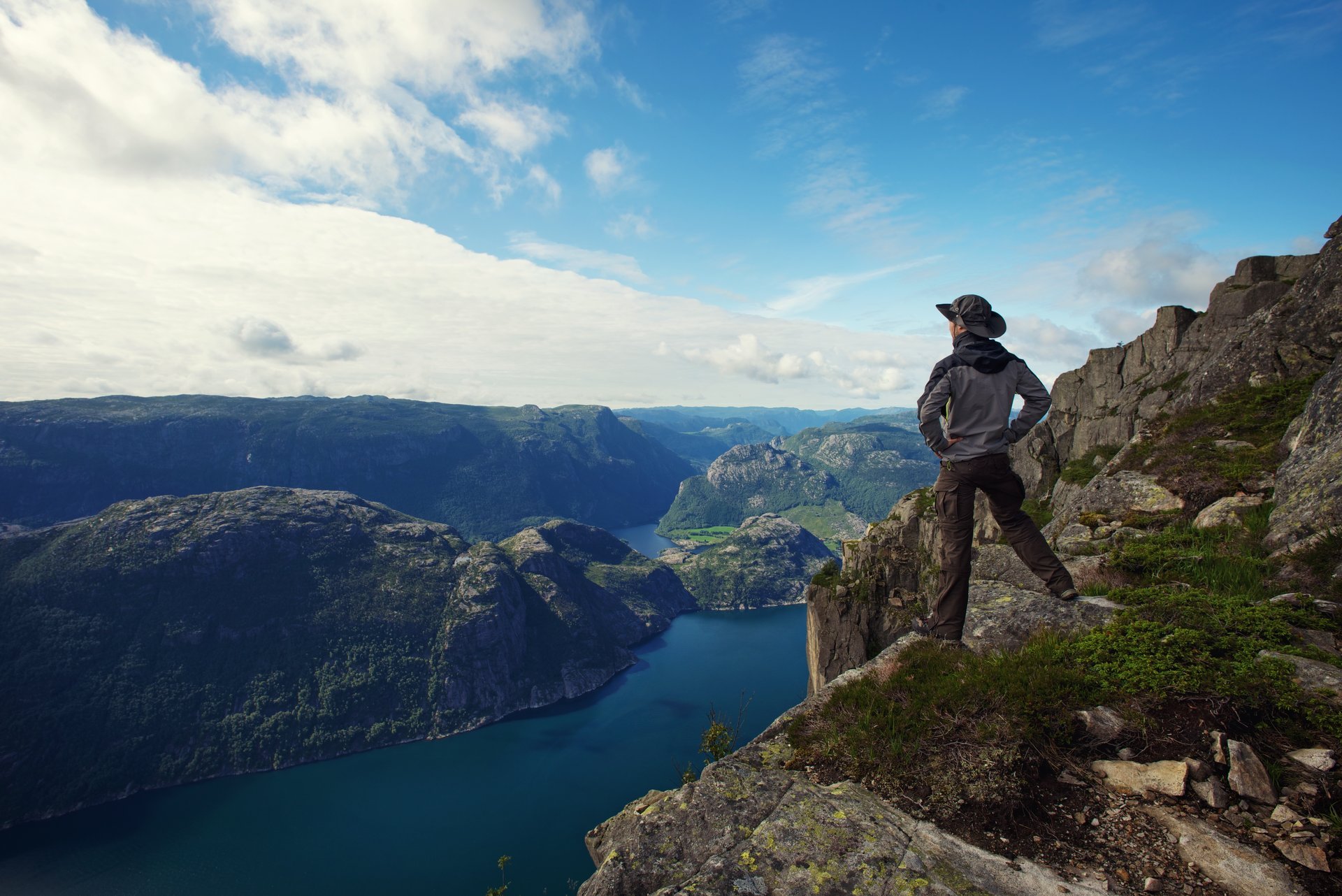 lonely guy man traveler tourist fjord sea sky mountain clouds nature lonely man fjords panorama mountain