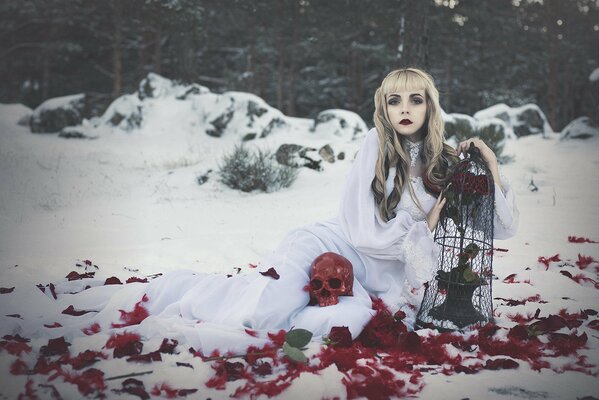 Blonde in a white dress and with a red skull surrounded by roses
