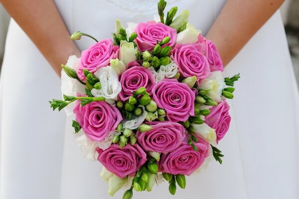 A bride with a wedding bouquet in her hands