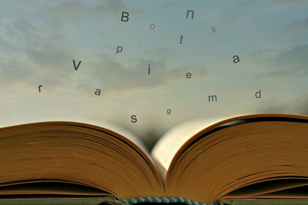 A book with flying Latin letters on the background of the sky