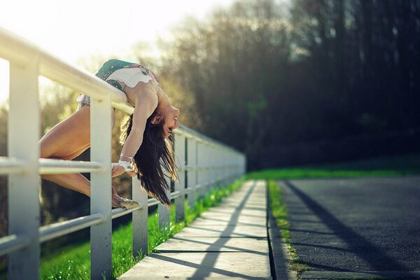 A girl in a pose on a beautiful background