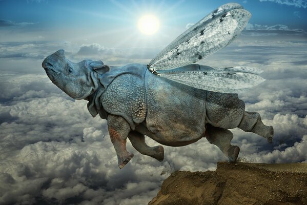 A hippopotamus with wings flies above the clouds against the background of the white sun