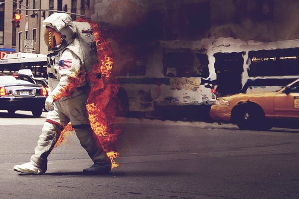 A burning astronaut walks along an ordinary street