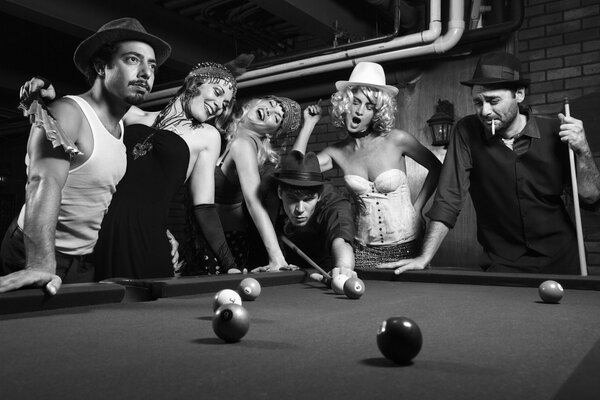 Billiards beautiful man surrounded by women