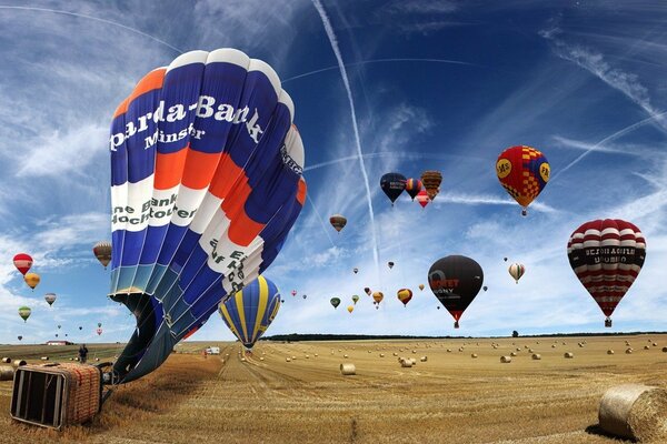 A parade of balloons in the blue sky