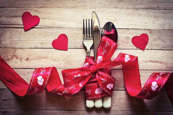 Cutlery is tied with a ribbon for lovers