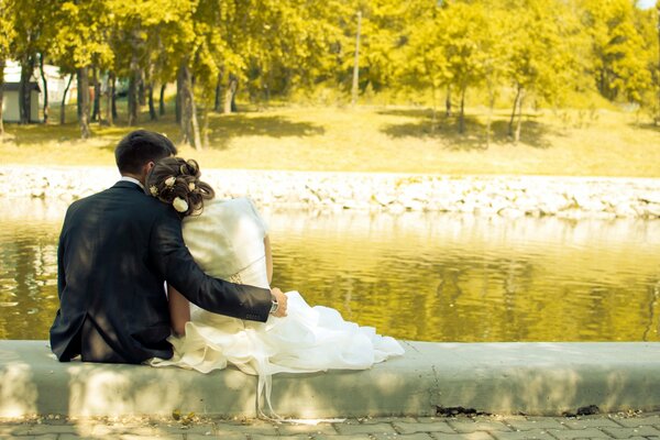 The bride and groom at the lake of love