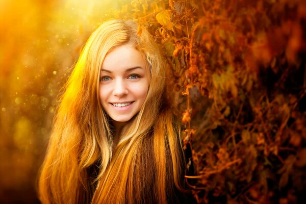 The girl with long hair smiles