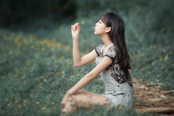 Asian girl on a background of greenery