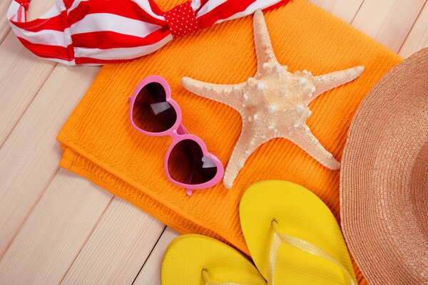 Beach accessories on beige background