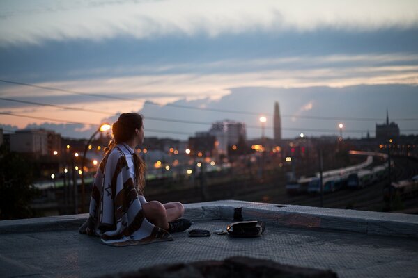 Girl on the roof in the evening