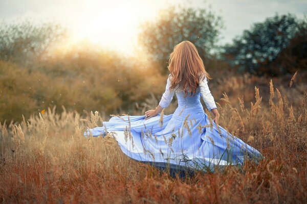 A magical girl in a dress in nature
