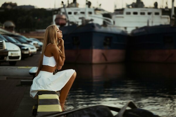 The girl in white. Port. Yachts