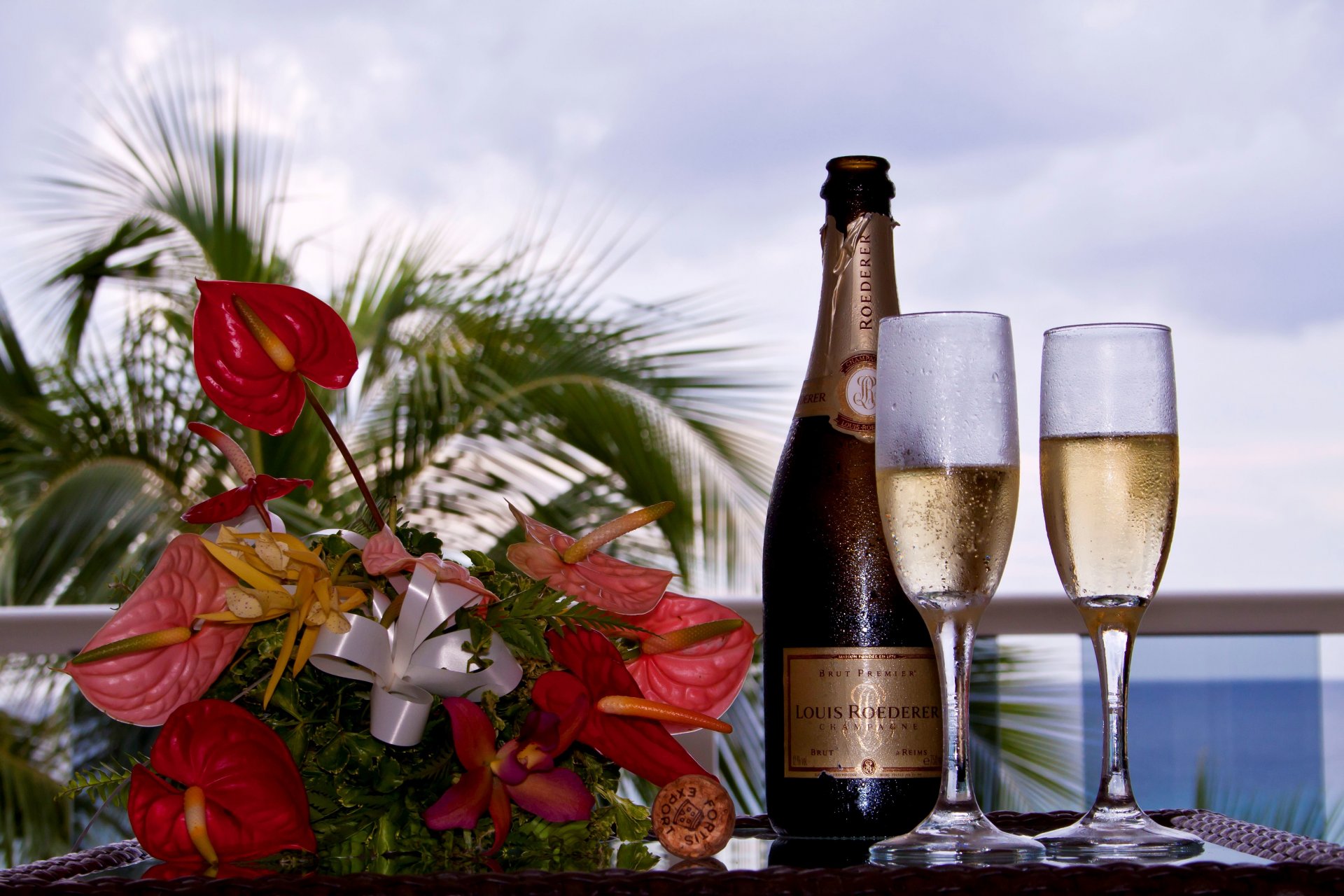 flower bouquet a bottle champagne louis roederer louis rёderer plug glasses background blur