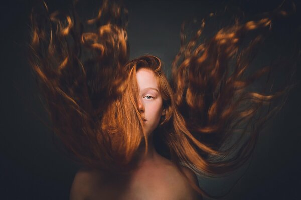 A wave of the red-haired girl s hair