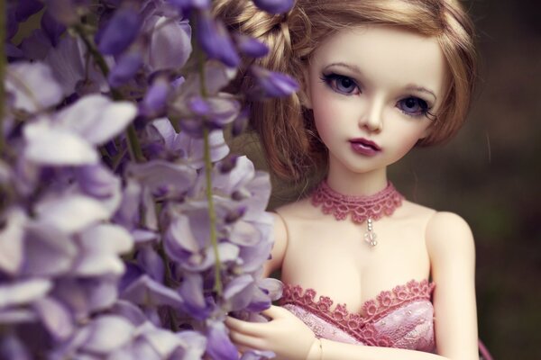 Doll with big eyes and blue flowers