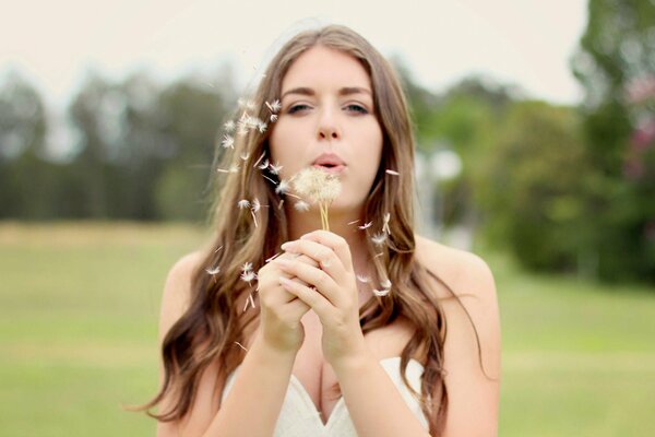 Photo of a girl and a dandelion