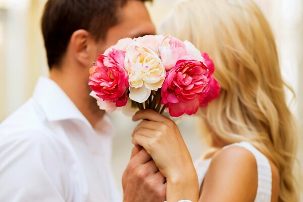 A couple s kiss in flowers