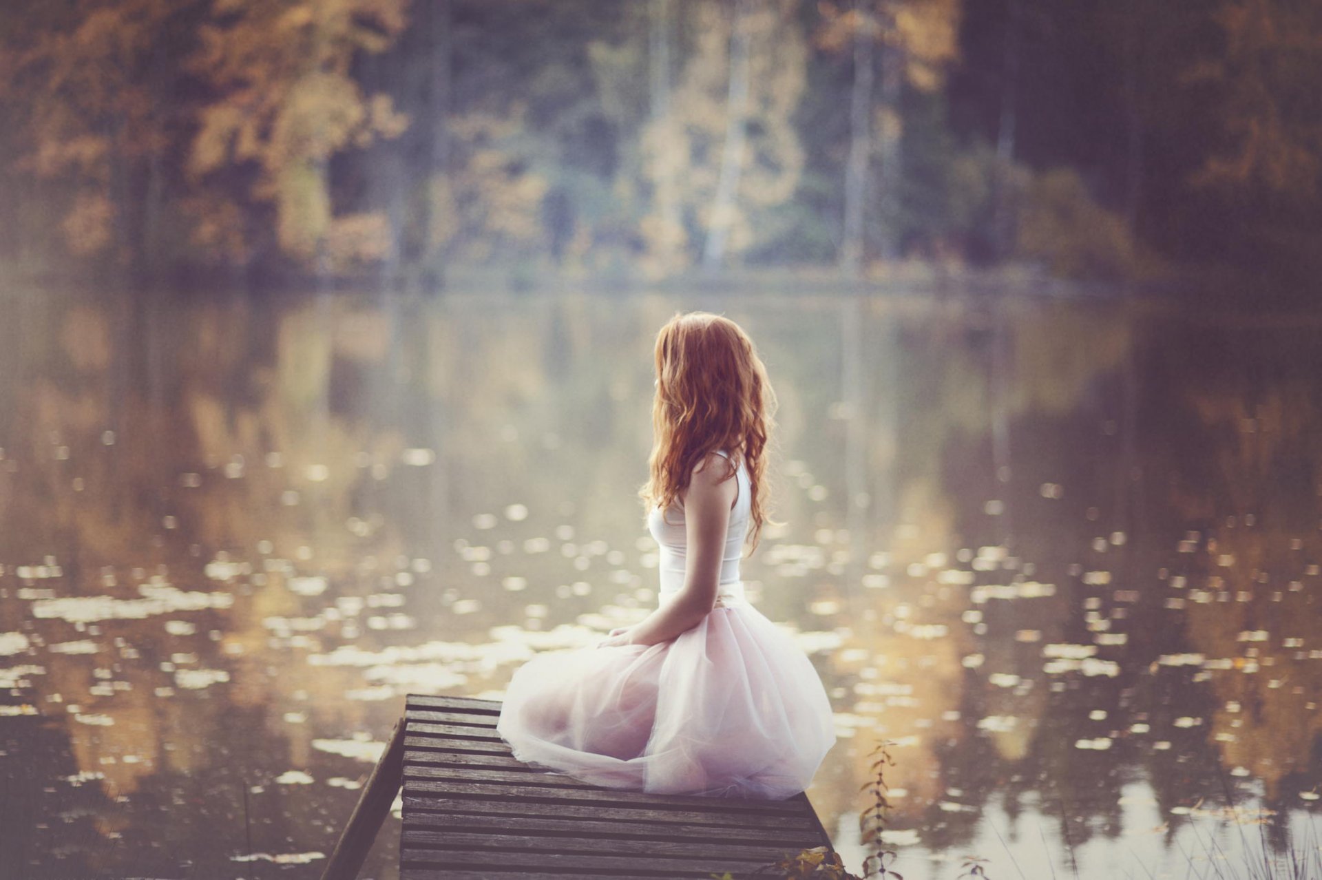 girl red hair dress nature autumn water blur