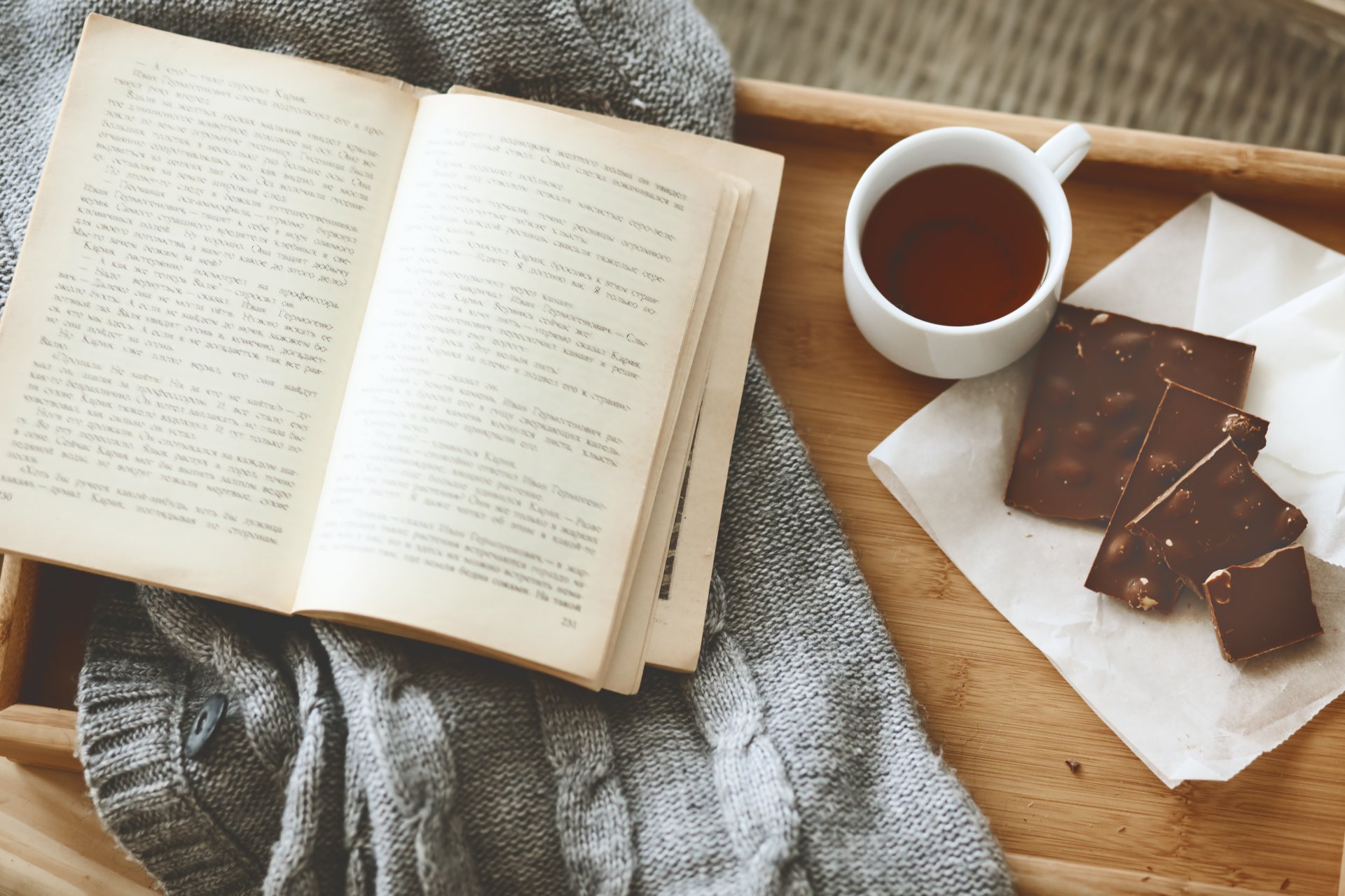 comfort tray book chocolate cup tea sweater