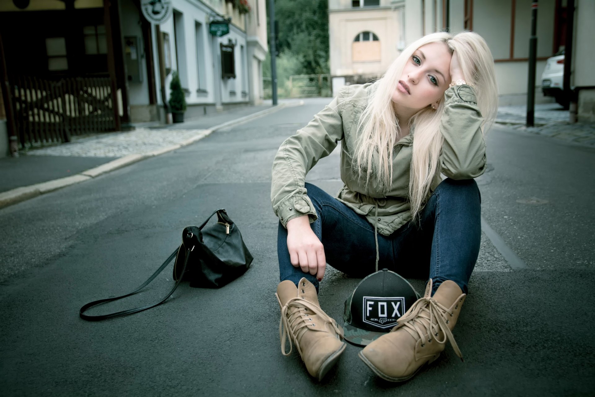 green-eyed blonde jeans cap handbag girl street town asphalt