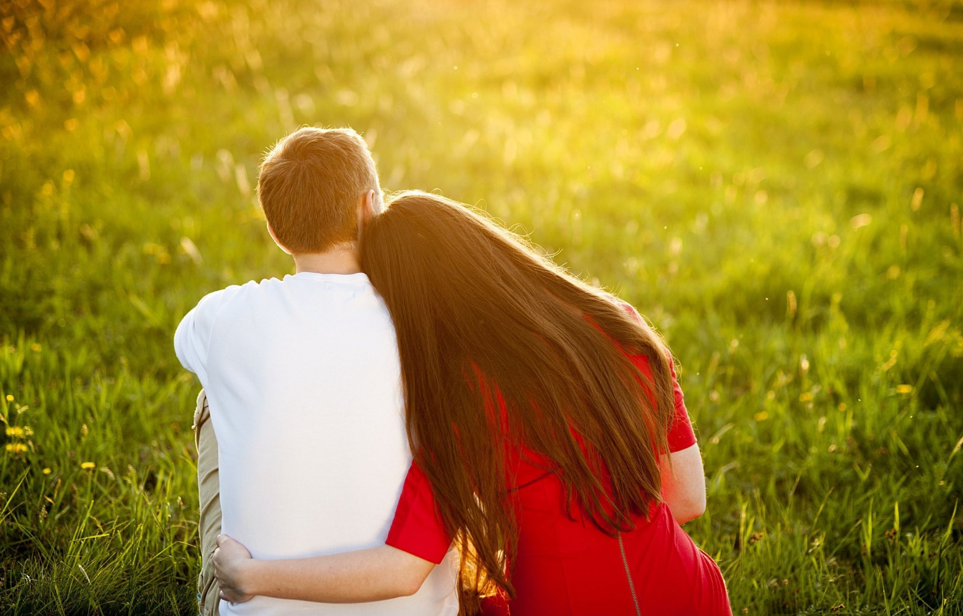 moods girl guy man woman brunette lovers couple couple rest grass greenery summer sun flowers warmth embrace tenderness feelings red dress love man romance nature background wallpaper widescreen fullscreen wide screen