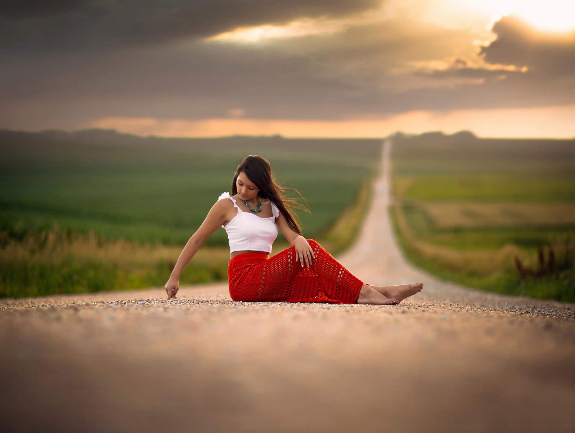 barefoot girl road space bokeh