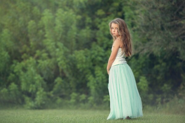 Sad girl on the edge of the forest