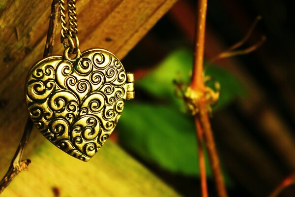 Heart-shaped pendant on branches