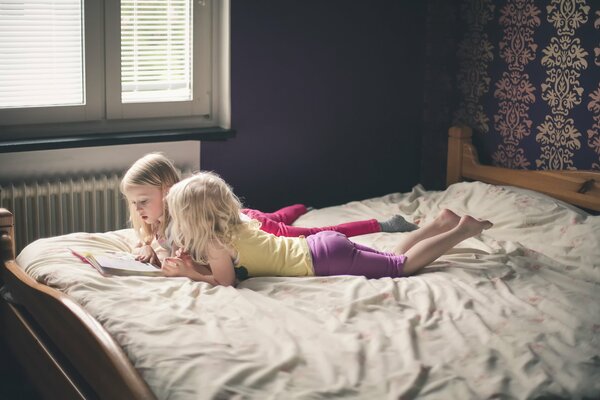 Photos of children. Girls are studying a book