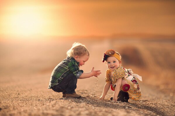 Beautiful kids play near the house