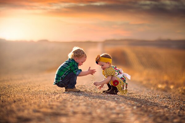 Photos of children on the background of a sandy road