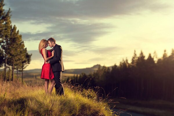 Beautiful couple on the background of nature