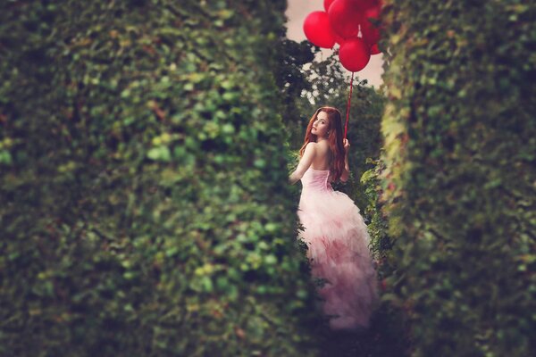 Girl in a dress in the garden