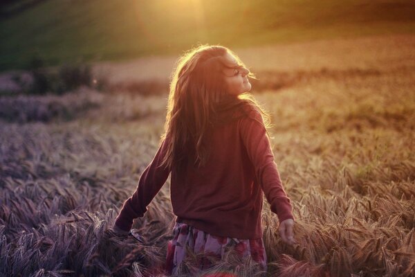 A girl in a field of wheat