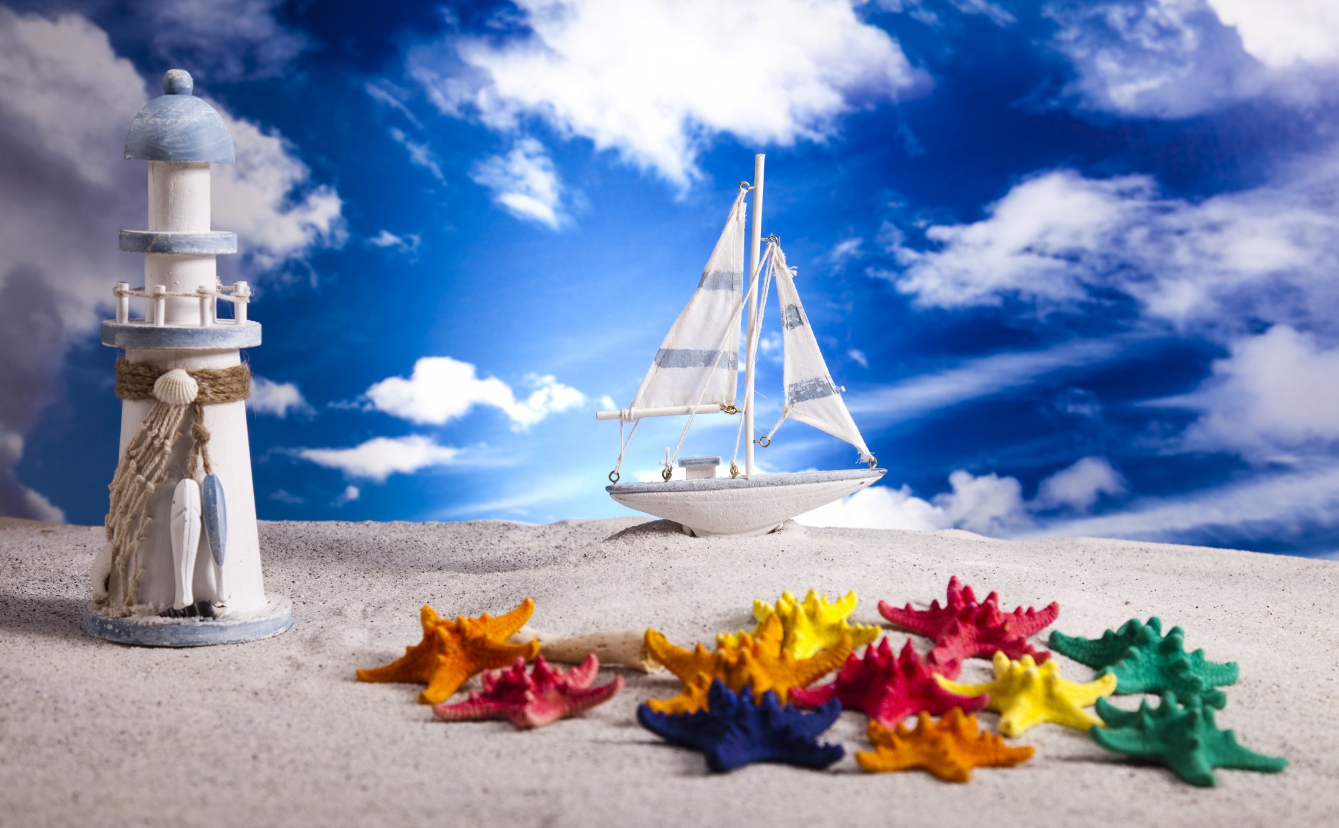 sand layout schiff leuchtturm seesterne himmel wolken