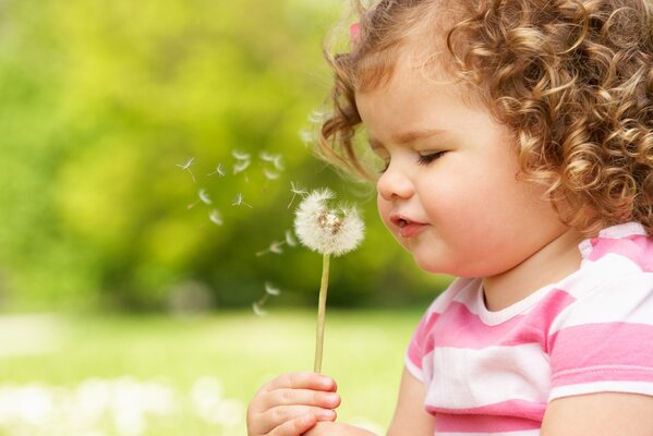 A girl in a moment of happiness, with springy curls