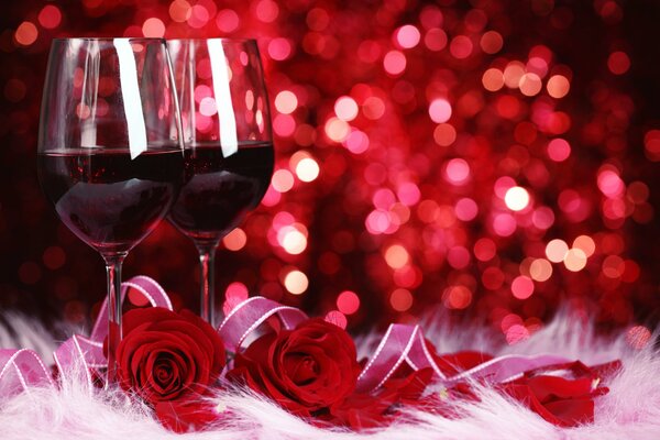 Verres de vin rouge et roses rouges en cadeau pour une tasse de thé lettre irrésistible