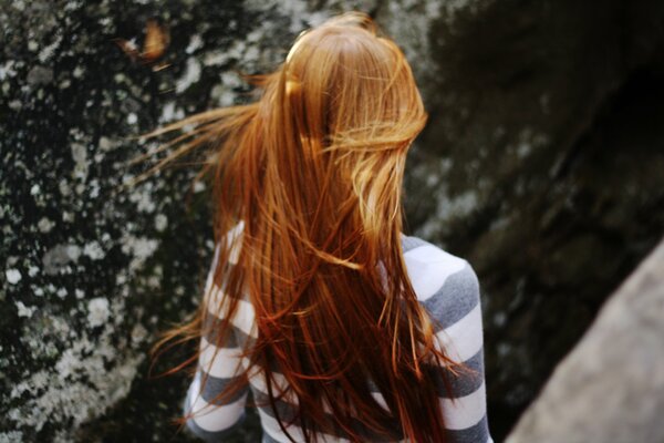 A girl with a back with golden hair