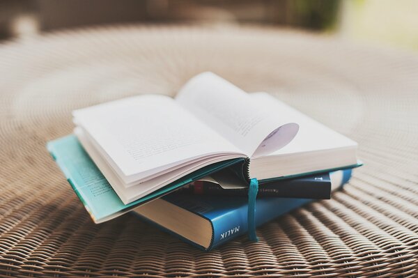 AN OPEN BOOK ON THE TABLE