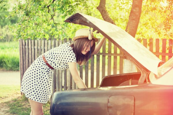 Girl in polka dot dress and hat