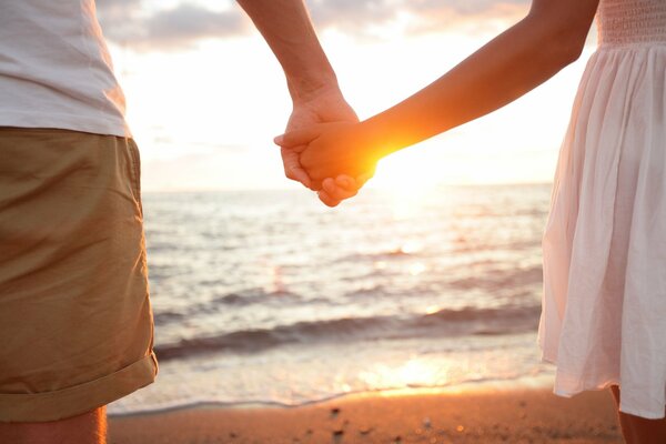 Guy with a girl on a sandy beach