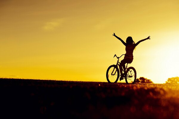 Bright mood of a girl on a bicycle